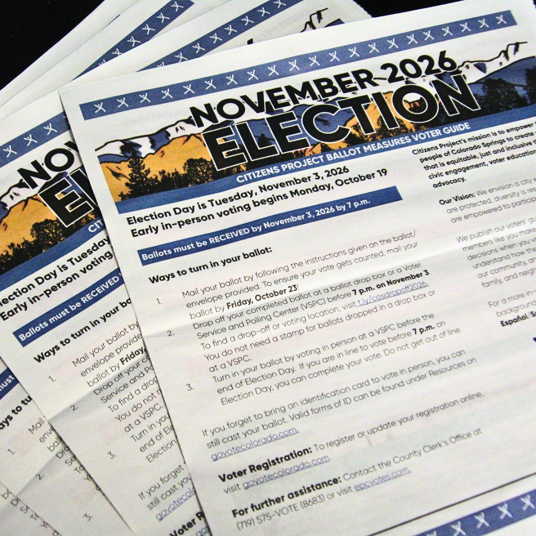 Several copies of Citizen Project's print voter guide for the November 2026 election.